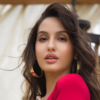 nora fatehi red dress photo Nora Fatehi Shows How To Rock Any Dress