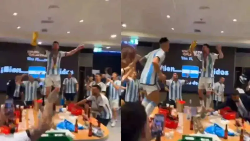 Lionel Messi celebrates his World Cup victory by dancing atop a table with the trophy