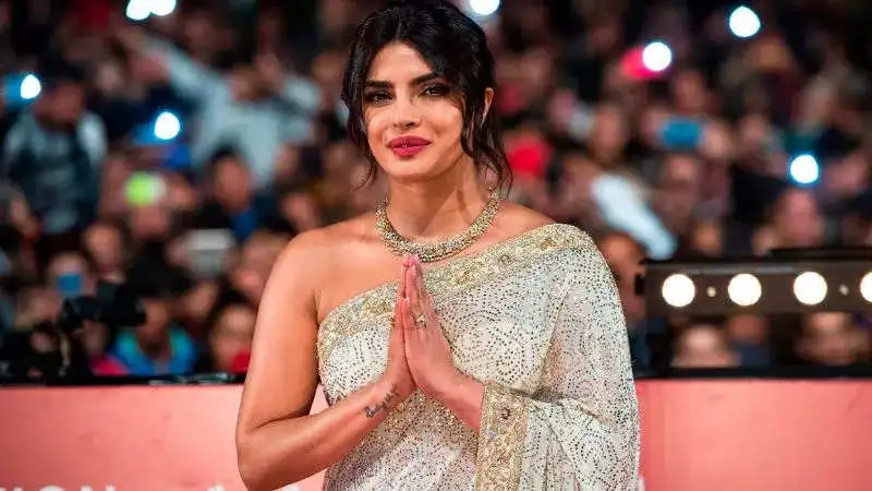 Desi girl, Priyanka Chopra looks stunning in sheer yellow saree!